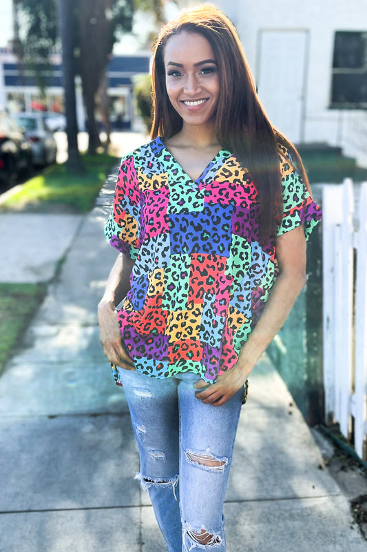 Dazzle in Multicolor Animal Patchwork V Neck Dolman Cap Sleeve Top